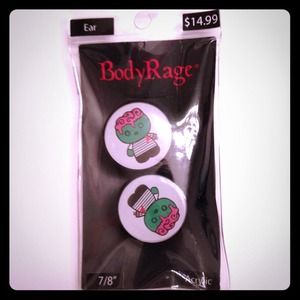 Brand new never worn 7/8" zombie kitty plugs