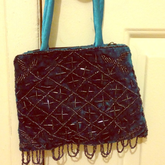 Blue suede handbag with beadwork