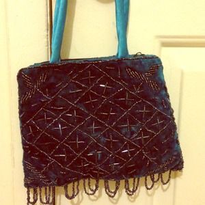 Blue suede handbag with beadwork