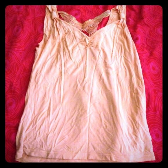 Peach pink top with butterfly detail!