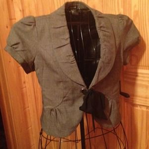 Grey with black stitching, light over jacket