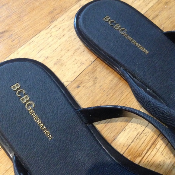 SOLD: BCBGenerarion Black Flip Flops W/ gold logo - Picture 2 of 4