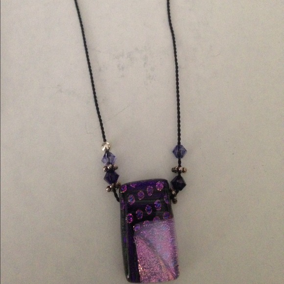 Black cord necklace with pink/purple pendant