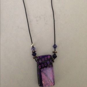 Black cord necklace with pink/purple pendant
