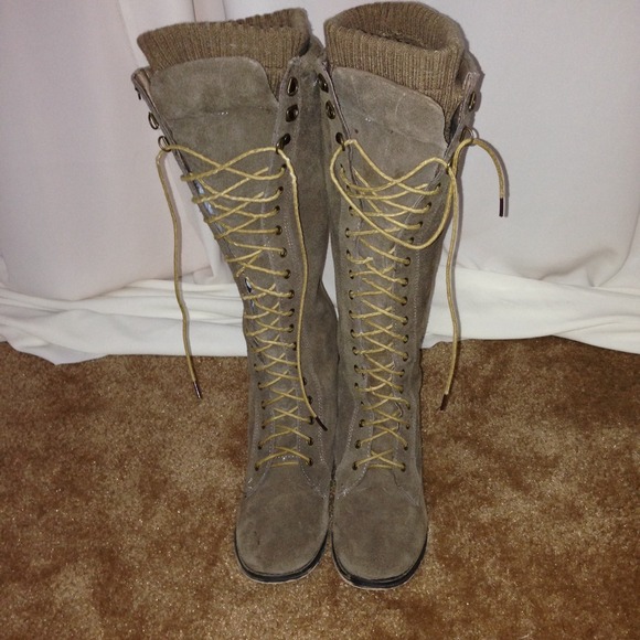 Knee high suede lace up military boots.