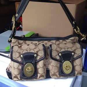Tan and black coach bag small to medium in size