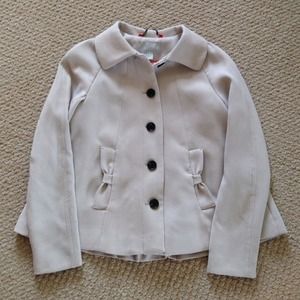 Beige cape style jacket with 3 necklaces