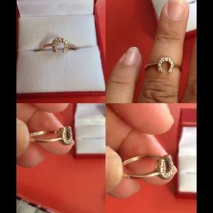 STAMPED 10 k horse shoe ring with small diamonds
