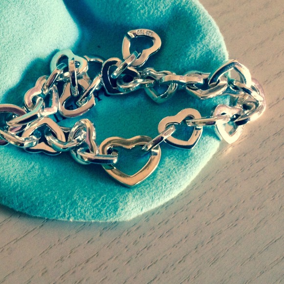 SOLD on Tradesy Tiffany SS heart bracelegold heart
