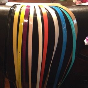 11 Assorted belts in an array of colors