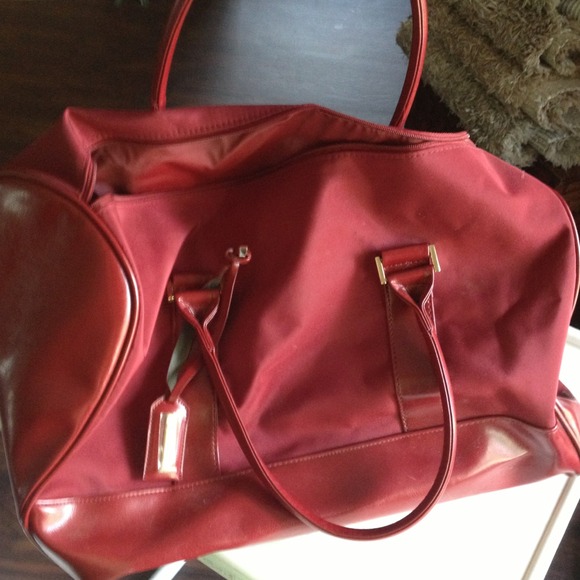 Claret  red Estée Lauder overnight bag
