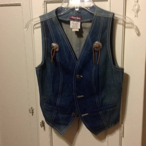 Vintage denim vest with silver concho accents.