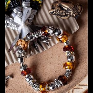 Art glass, crystal bead n silver, gold, n brown