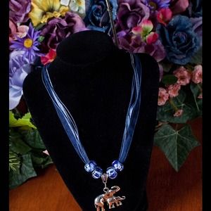 Necklace with organza and satin rib. And elephant