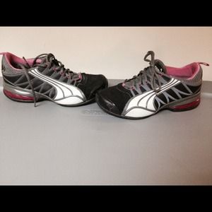 Woman's 7 1/2 pink and gray Puma running shoes.