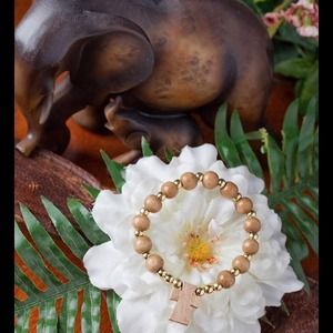 Bracelet, natural wood beads, gold beads n a cross