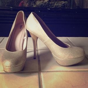 Gold glitter platform heels.