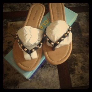 Sandals with studs along the straps