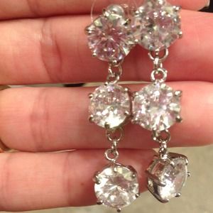 Custom silver past, present and future earrings.