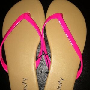 Bright pink flip flops