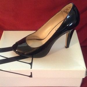 Classic black peep toe pumps