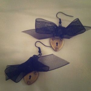 Bow and lock earrings.