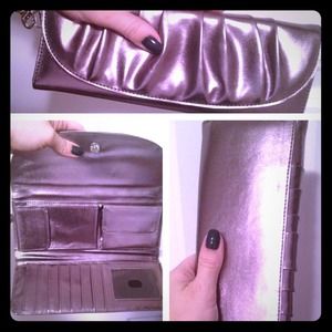 Clutch purse with wrist strap.