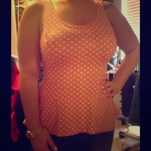 Peach/white polka dot sleeveless peplum top
