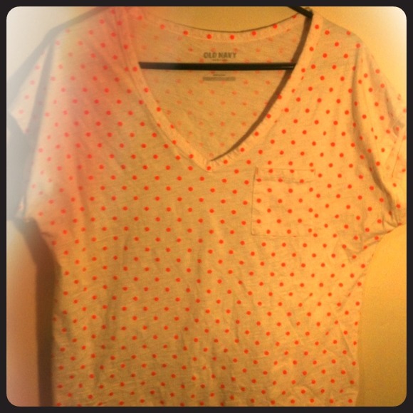 White shirt with neon orange polka dots