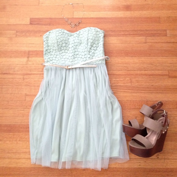 Mint Strapless dress with gold accent belt.