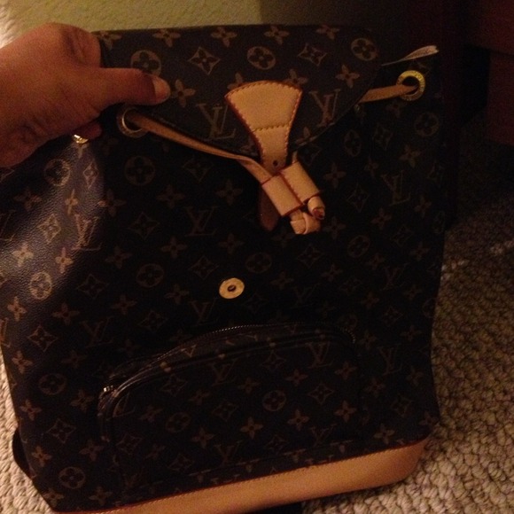 Brown and tan backpack used a lot has wear n tear