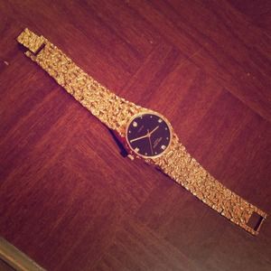 Andre Giroud gold an diamond watch