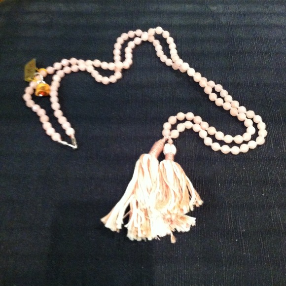 Chan Luu faceted rose quartz beads on silk cord.