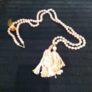Chan Luu faceted rose quartz beads on silk cord.