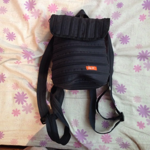 Black zip it backpack.