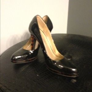 Black patent stilettos with leopard print heels