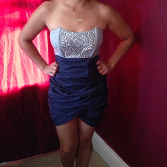 Metal detailed dress with flirty tulip skirt.