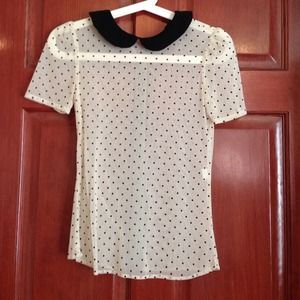 Sheer polka-dot top with black peter/pan collar