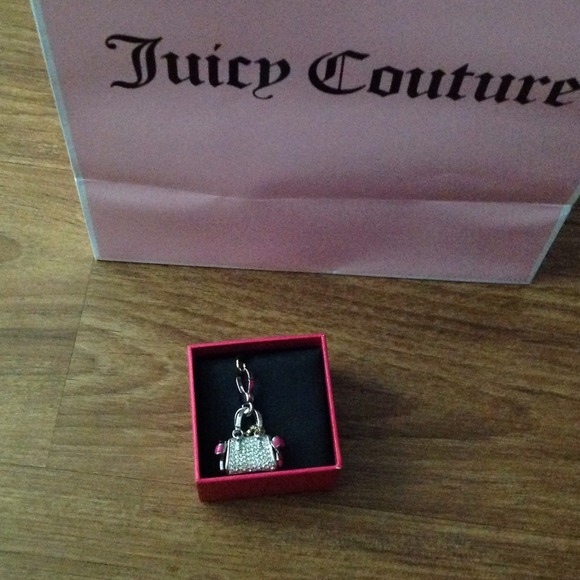 Juicy Couture silver purse charm with pink bows.