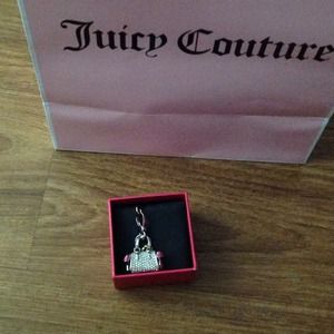Juicy Couture silver purse charm with pink bows.