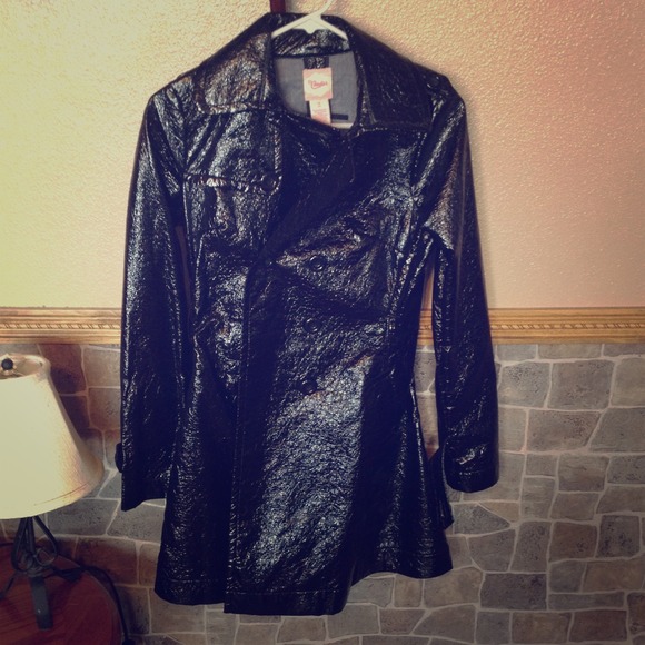 Black rain/trench coat and blue skirt