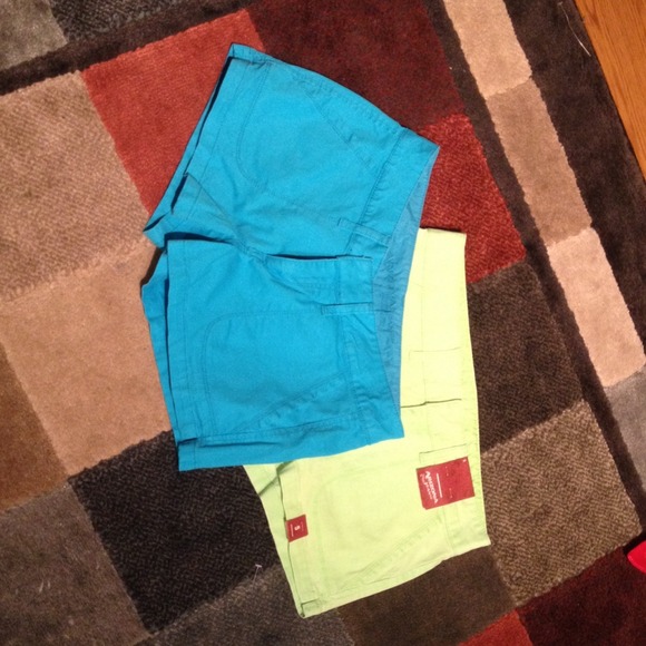 Two neon colored shorts