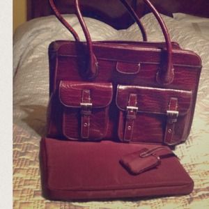 Maroon faux snake skin bag.