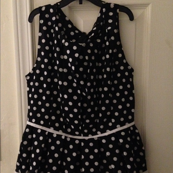 A black top with white polka dot.