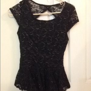 Black peplum shirt with glitter accents