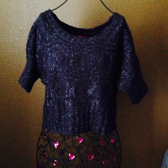 A sparkly gray sweater