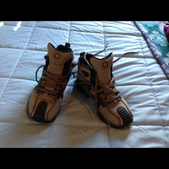 Hiking boots. Holding