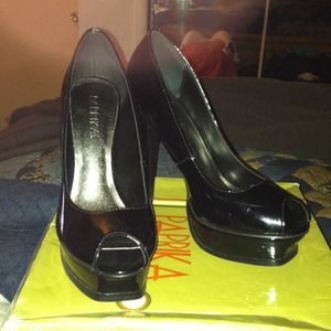 Black patent leather heels and pink heels