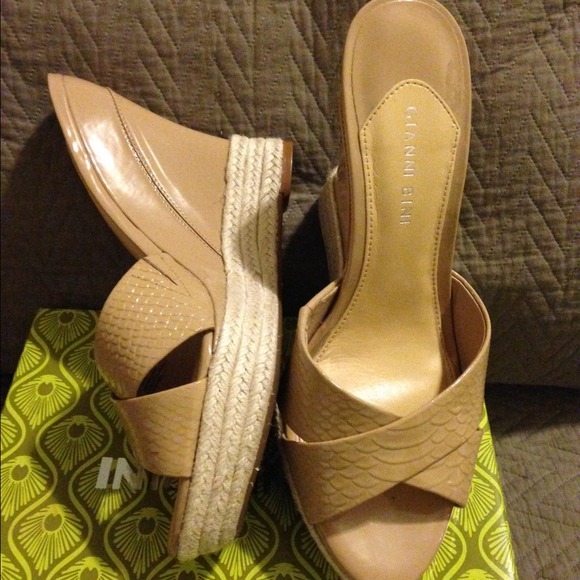 Tan, wedge, step-in shoe.