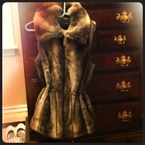 Faux fur zip up vest.
